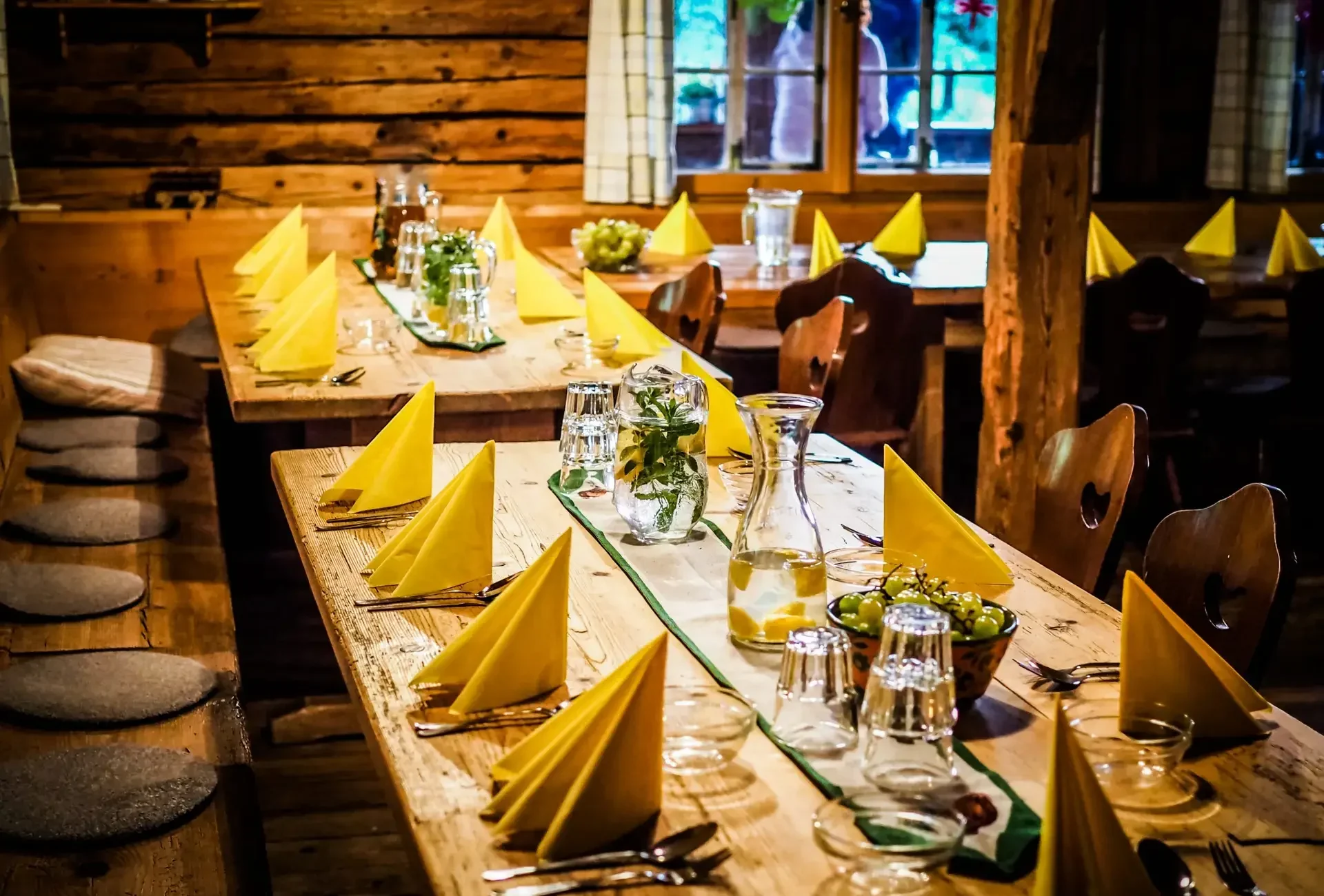Table,Set,With,Yellow,Napkins,And,White,Empty,Plates,On